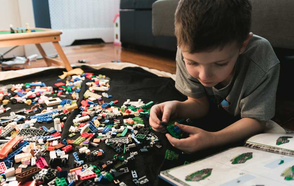 A child with crayons enthusiastically spread out everywhere - let's get ready to make reliability art!